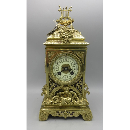 217 - Vincenti, French brass mantle clock, cast brass case, pierced fabric backed sound frets, 3