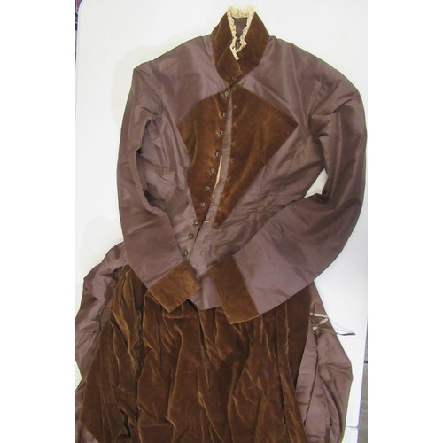 164 - Victorian/Early Edwardian skirt suit featuring a skirt with small integrated bustle and a velvet apr... 