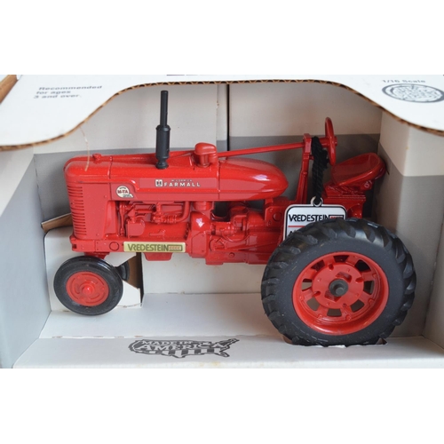 598A - Four boxed 1/16 scale diecast metal tractor models from Ertl to include Massey Harris 55, McCormick ... 