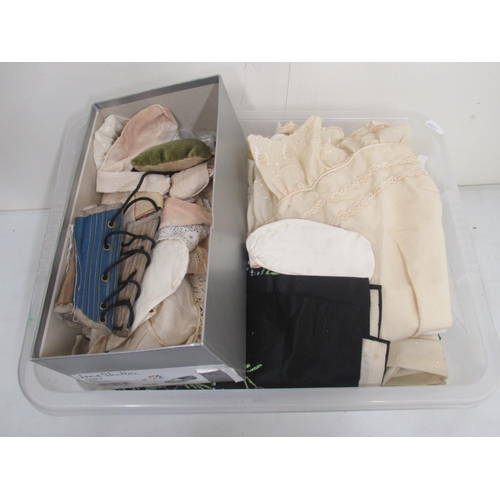 235 - Twelve dolls, collection of doll parts and a collection of doll clothes (4 boxes)