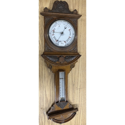 1202 - Early 20th Century carved oak aneroid barometer with thermometer box, H79cm