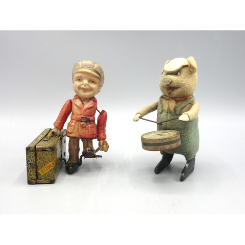 171 - Two clockwork toys: Shuco drumming pig, felt covered tin plate, H11.5cm, and a Japanese celluloid an... 