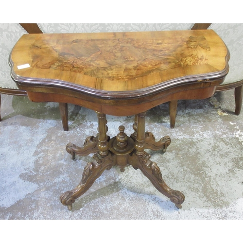 130 - Victorian walnut card table, shaped swivel top on four column supports and four carved cabriole legs... 