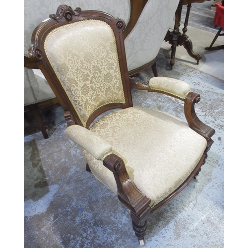 132 - Victorian walnut framed open arm chair, upholstered back and seat on turned supports with ceramic ca... 