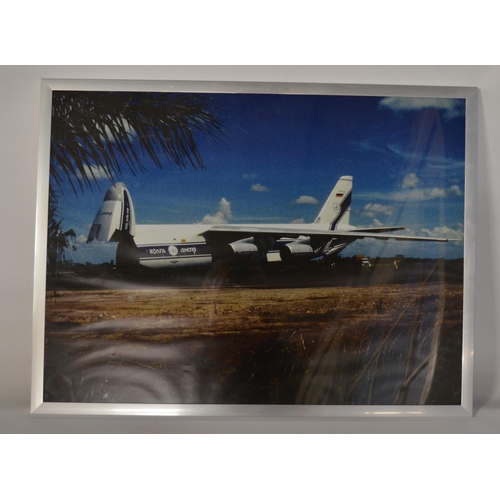 13 - Collection of Volga-Dnepr framed pictures and prints (largest example 141x89cm) and an inhouse produ... 