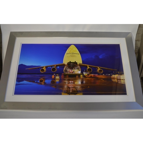 13 - Collection of Volga-Dnepr framed pictures and prints (largest example 141x89cm) and an inhouse produ... 