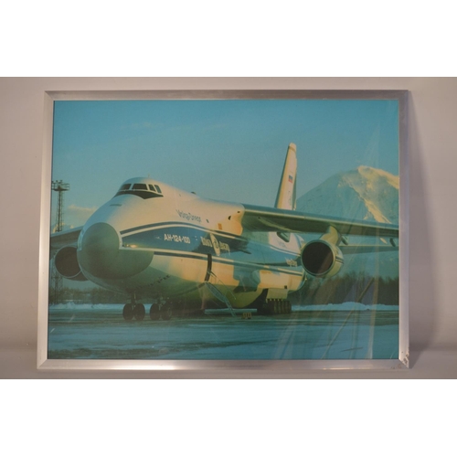 13 - Collection of Volga-Dnepr framed pictures and prints (largest example 141x89cm) and an inhouse produ... 