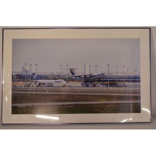 13 - Collection of Volga-Dnepr framed pictures and prints (largest example 141x89cm) and an inhouse produ... 