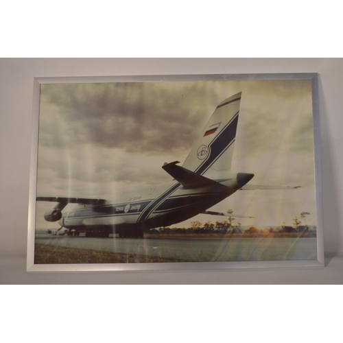 13 - Collection of Volga-Dnepr framed pictures and prints (largest example 141x89cm) and an inhouse produ... 