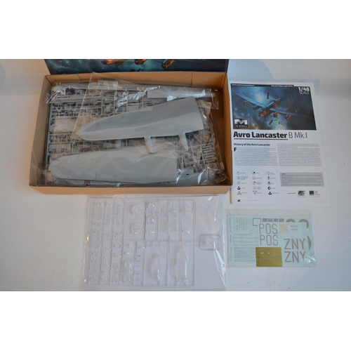 24 - Two unstarted 1/48 scale WW2 themed plastic model kits to include a Hong Kong Models Avro Lancaster ... 