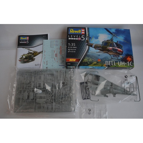 43 - Four unstarted plastic model kits, WWII/Vietnam War themed to include a 1/35 scale Tamiya M4A3 Sherm... 