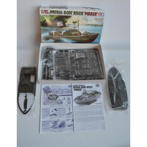 43 - Four unstarted plastic model kits, WWII/Vietnam War themed to include a 1/35 scale Tamiya M4A3 Sherm... 