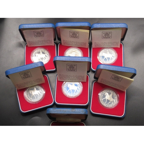 149 - Royal Mint - 7 Silver Proof The Queens Silver Jubilee Crown Pieces encapsulated in original cases, 6... 