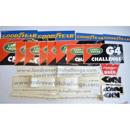 64 - Land Rover G4 Challenge collection to include 5x pressed relief text metal vehicle plates, adhesive ... 