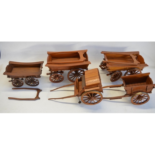 75 - Collection of attractive large scale wooden cart models with metal rimmed wheels, largest examples a... 