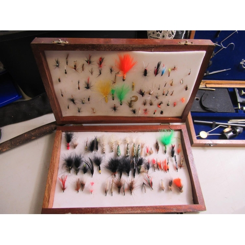 427 - Wooden case of fly-fishing lures of various styles with a cased fly-maker's vice and assortment of f... 