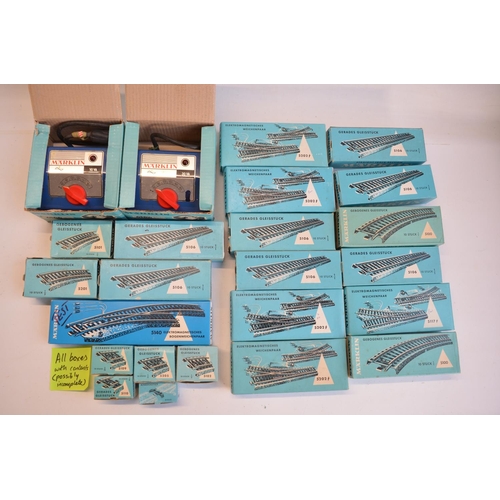 111 - Collection of Marklin 3 rail HO gauge track including boxed packs, also included empty track boxes, ... 