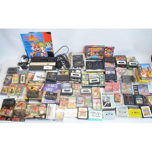 96B - An Atari 2600 vintage gaming console (no controllers) and a collection of vintage video games, mostl... 