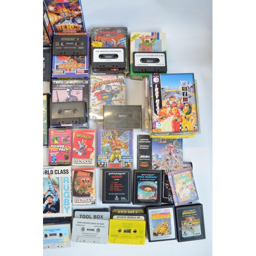 96B - An Atari 2600 vintage gaming console (no controllers) and a collection of vintage video games, mostl... 