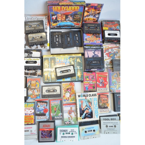 96B - An Atari 2600 vintage gaming console (no controllers) and a collection of vintage video games, mostl... 