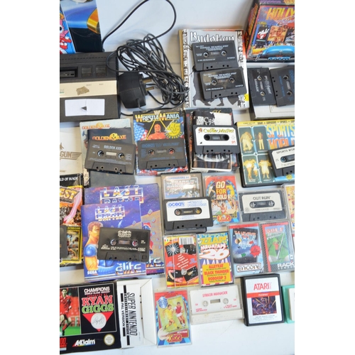 96B - An Atari 2600 vintage gaming console (no controllers) and a collection of vintage video games, mostl... 