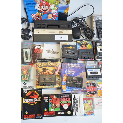 96B - An Atari 2600 vintage gaming console (no controllers) and a collection of vintage video games, mostl... 