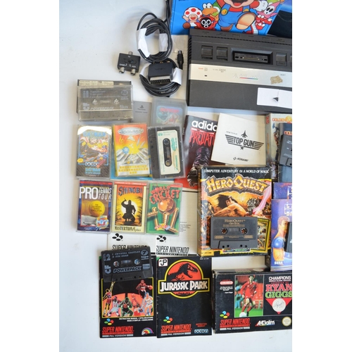 96B - An Atari 2600 vintage gaming console (no controllers) and a collection of vintage video games, mostl... 