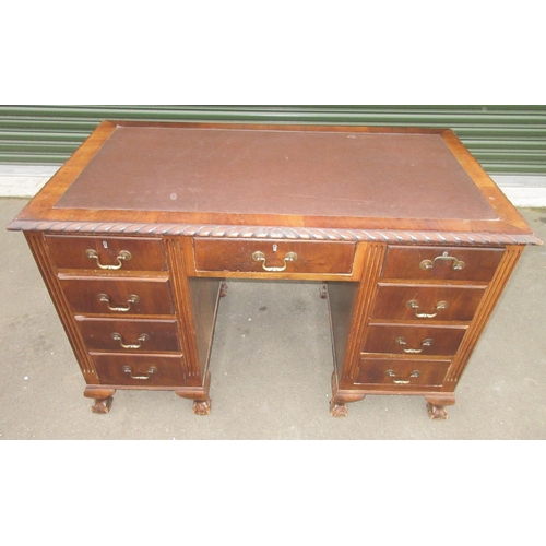 1311 - Geo. 111 style mahogany kneehole desk, inset top with gadrooned edge above nine drawers on claw and ... 