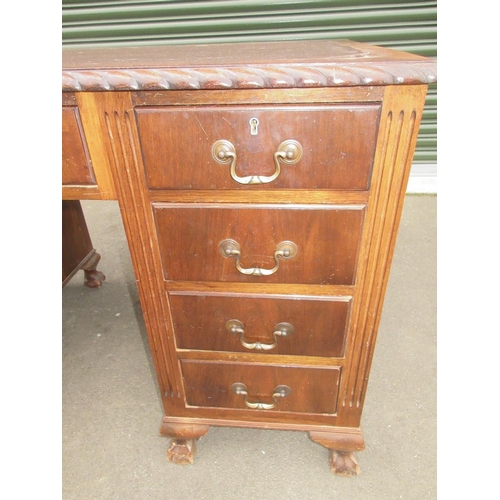 1311 - Geo. 111 style mahogany kneehole desk, inset top with gadrooned edge above nine drawers on claw and ... 