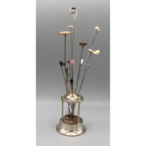 720 - Collection of hatpins, including one silver hat pin featuring stylized thistle finial set with purpl... 