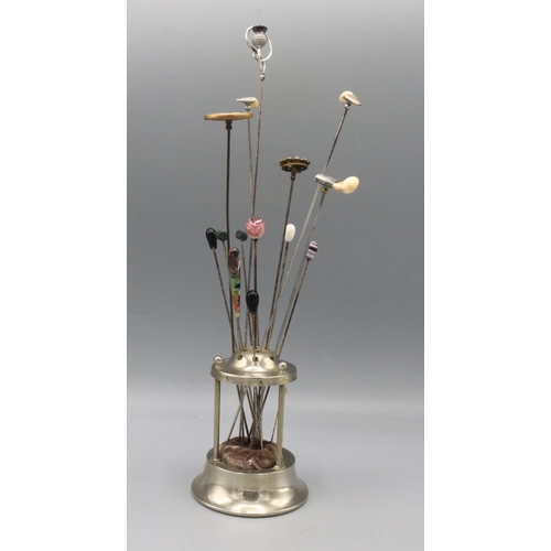 720 - Collection of hatpins, including one silver hat pin featuring stylized thistle finial set with purpl... 