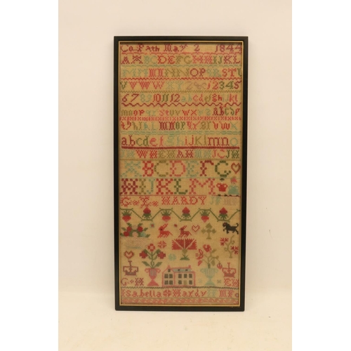 721 - Victorian embroidery needlework sampler, in multiple wool threads, featuring alphabet lettering, flo... 