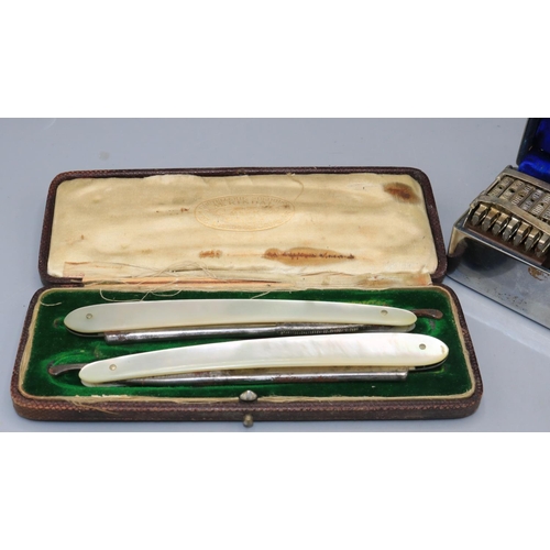 725 - Pair of M. Kindal mother of pearl straight razors and Wilkinson Sword seven day razor set in metal c... 