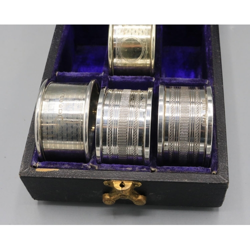 730 - Two silver napkin rings by Henry Griffith & Sons Ltd, Birmingham, 1974; silver napkin ring by Edwin ... 