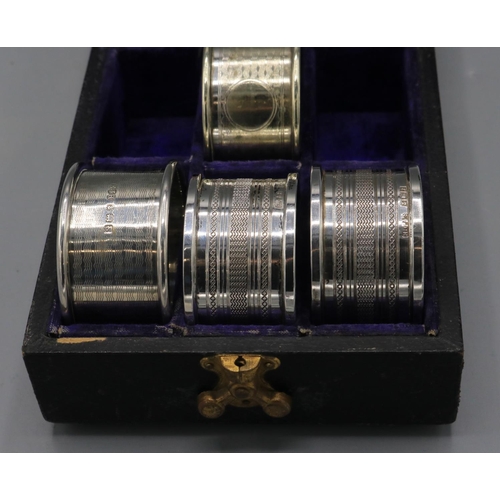 730 - Two silver napkin rings by Henry Griffith & Sons Ltd, Birmingham, 1974; silver napkin ring by Edwin ... 