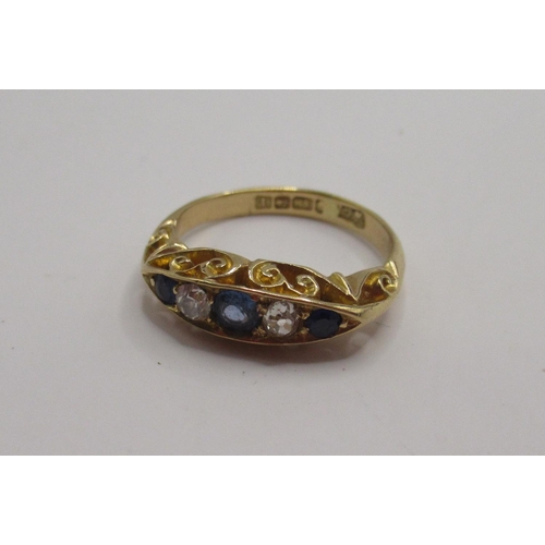 12 - 18ct yellow gold five stone ring set with sapphires and diamonds, stamped 18, 3.42g