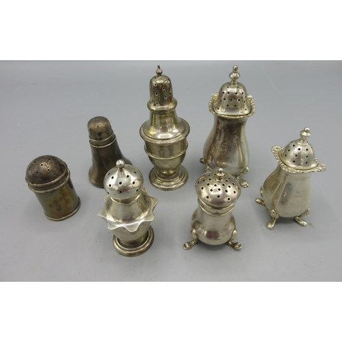 170 - Victorian silver pepperette on pedestal foot with unusual wavy skirt and pierced top by Edward Barna... 