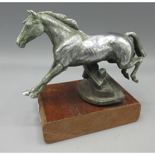 1265 - Chromed bronze car mascot hood ornament in the form of a horse leaping a fence, H11.5cm excl. mount