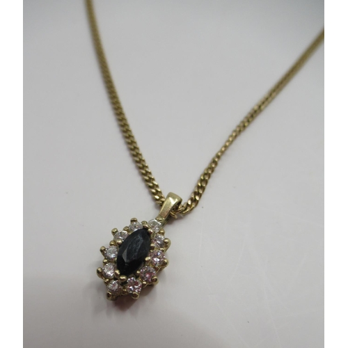 42 - Yellow metal pendant set with sapphire surrounded by white stones, on 9ct gold chain, stamped 375, a... 