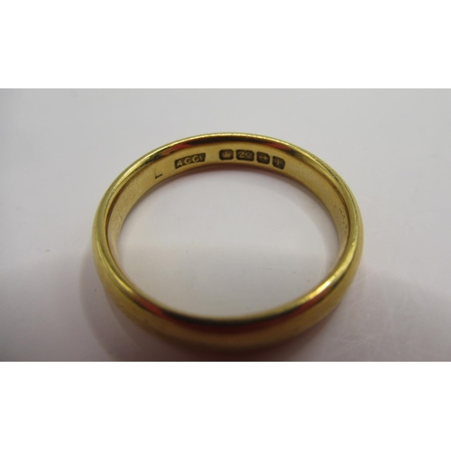 53 - 22ct yellow gold wedding band, stamped 22, size J1/2, 3.74g