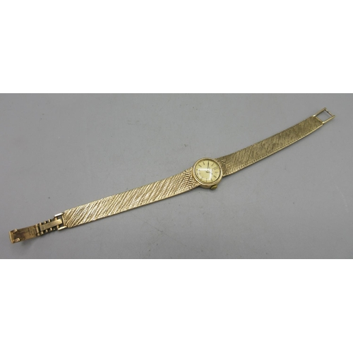 733 - Omega ladies 9ct gold wristwatch on integrated fine mesh bracelet stamped .375, signed gold coloured... 