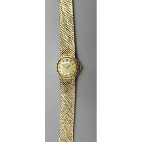 733 - Omega ladies 9ct gold wristwatch on integrated fine mesh bracelet stamped .375, signed gold coloured... 