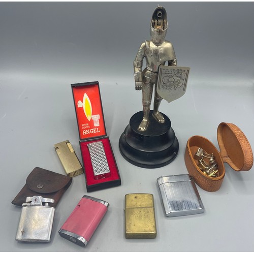 324 - Collection of vintage lighters to include, 20thC musical knight table lighter, zippo lighter, two Ro... 