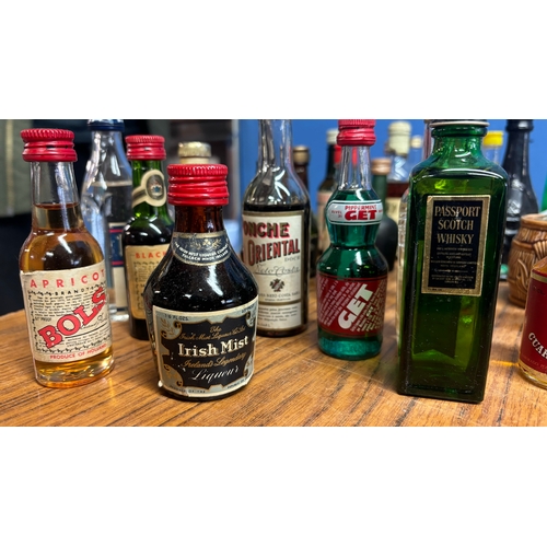 437 - A collection of 70 vintage miniatures from around the world, including Tequila, whisky, liquors etc.