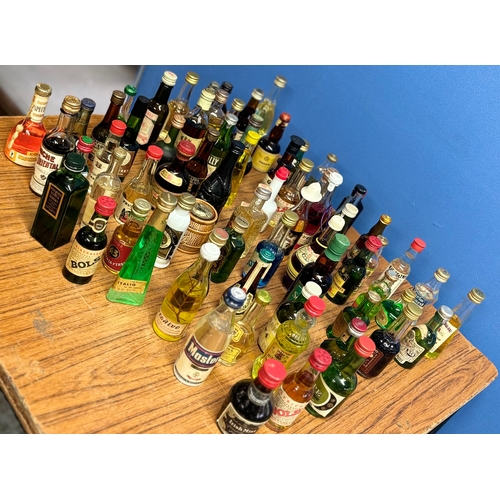 437 - A collection of 70 vintage miniatures from around the world, including Tequila, whisky, liquors etc.