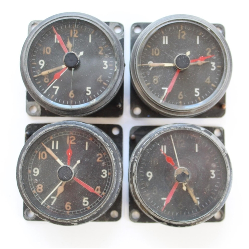 1380 - Four Smith & sons 8 day cockpit clocks. Stamped AM on the back. Used in various aircraft during WWII