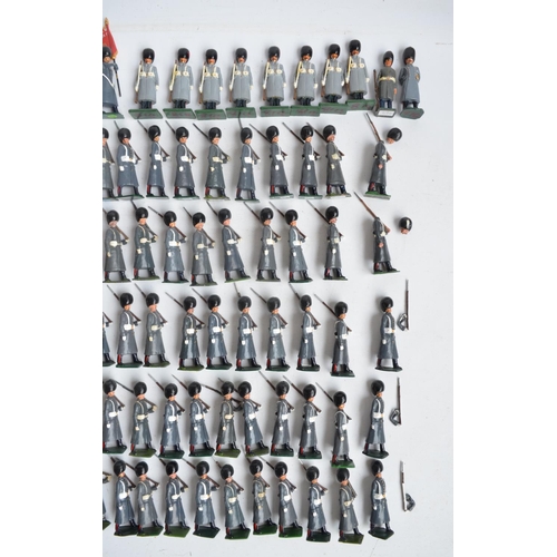 78 - Collection of metal Guardsmen model soldier figures in greatcoats to include W. Britain's, most/all ... 