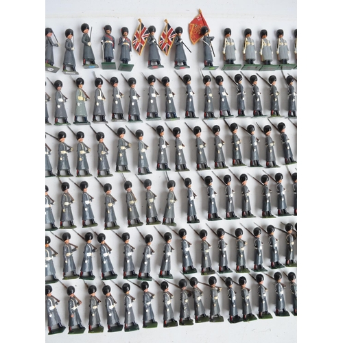 78 - Collection of metal Guardsmen model soldier figures in greatcoats to include W. Britain's, most/all ... 