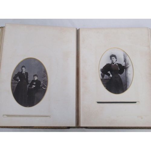  Three Victorian photograph albums containing period carte de visite portraits and cabinet cards