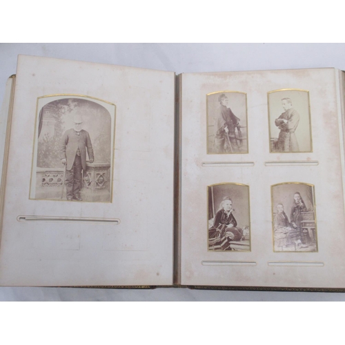  Three Victorian photograph albums containing period carte de visite portraits and cabinet cards